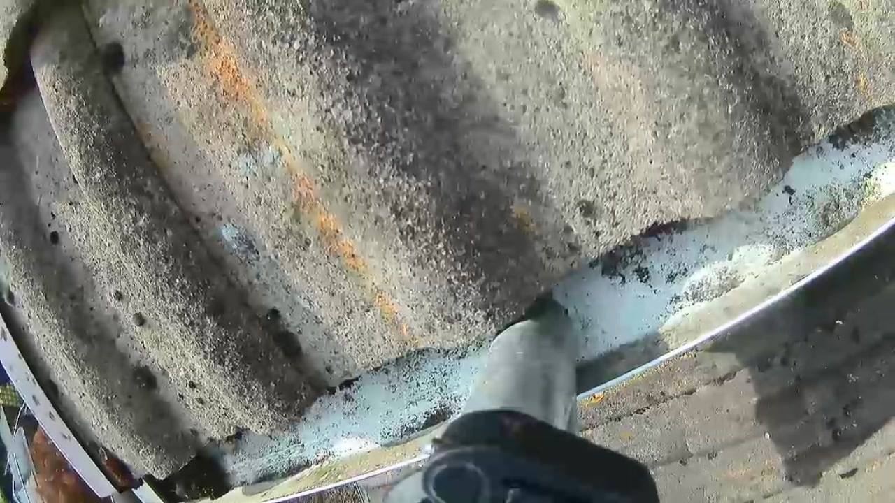 Close-up of a gutter clean in progress