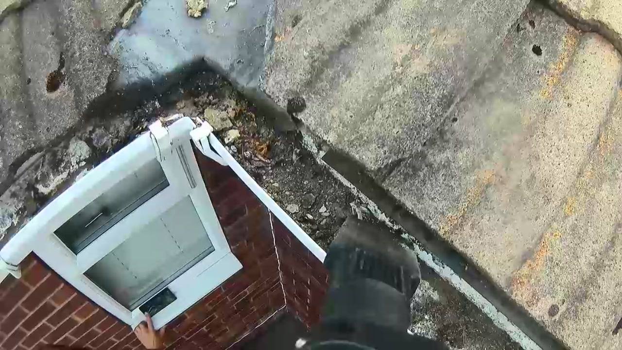 Clean white downpipe on a brick exterior