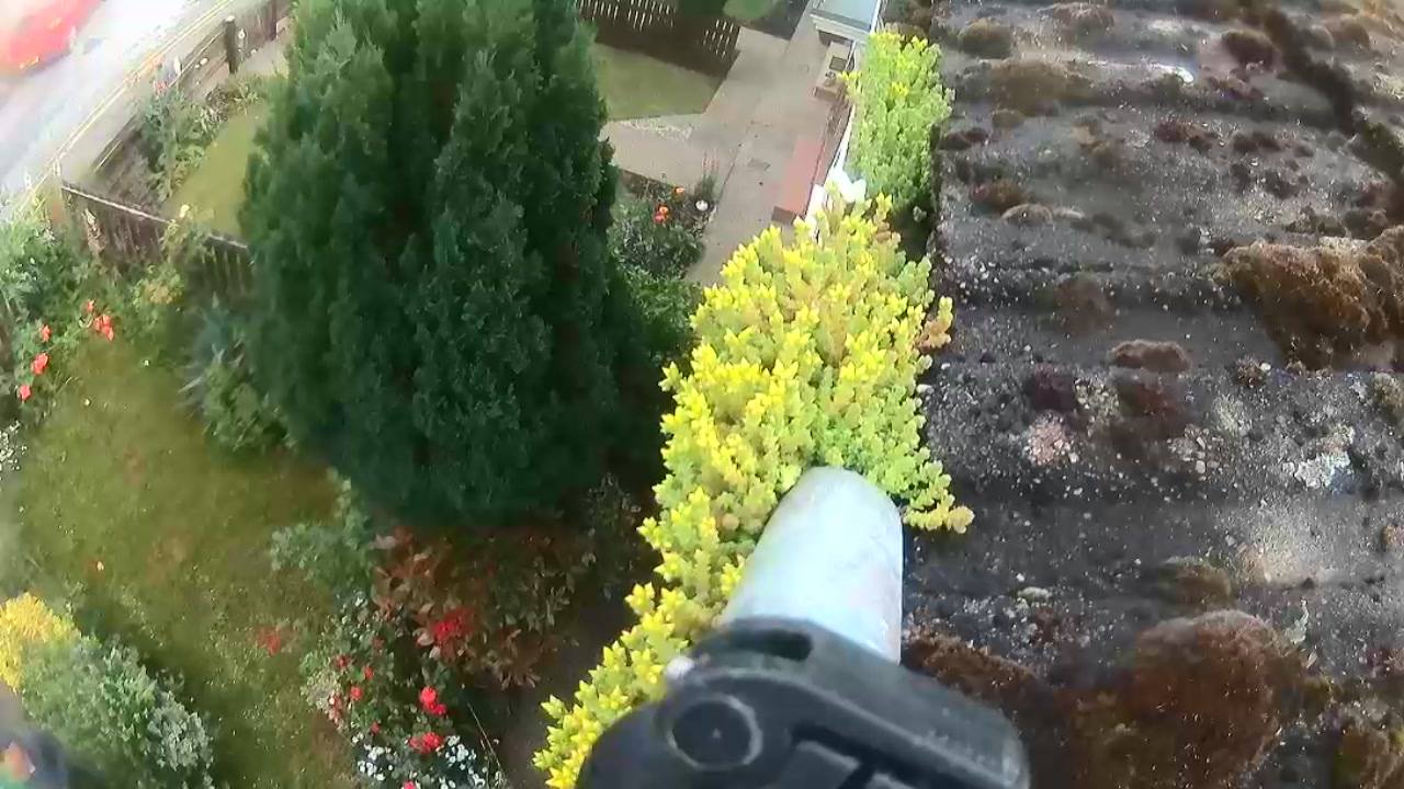 Aerial view of a garden with cleaned gutters